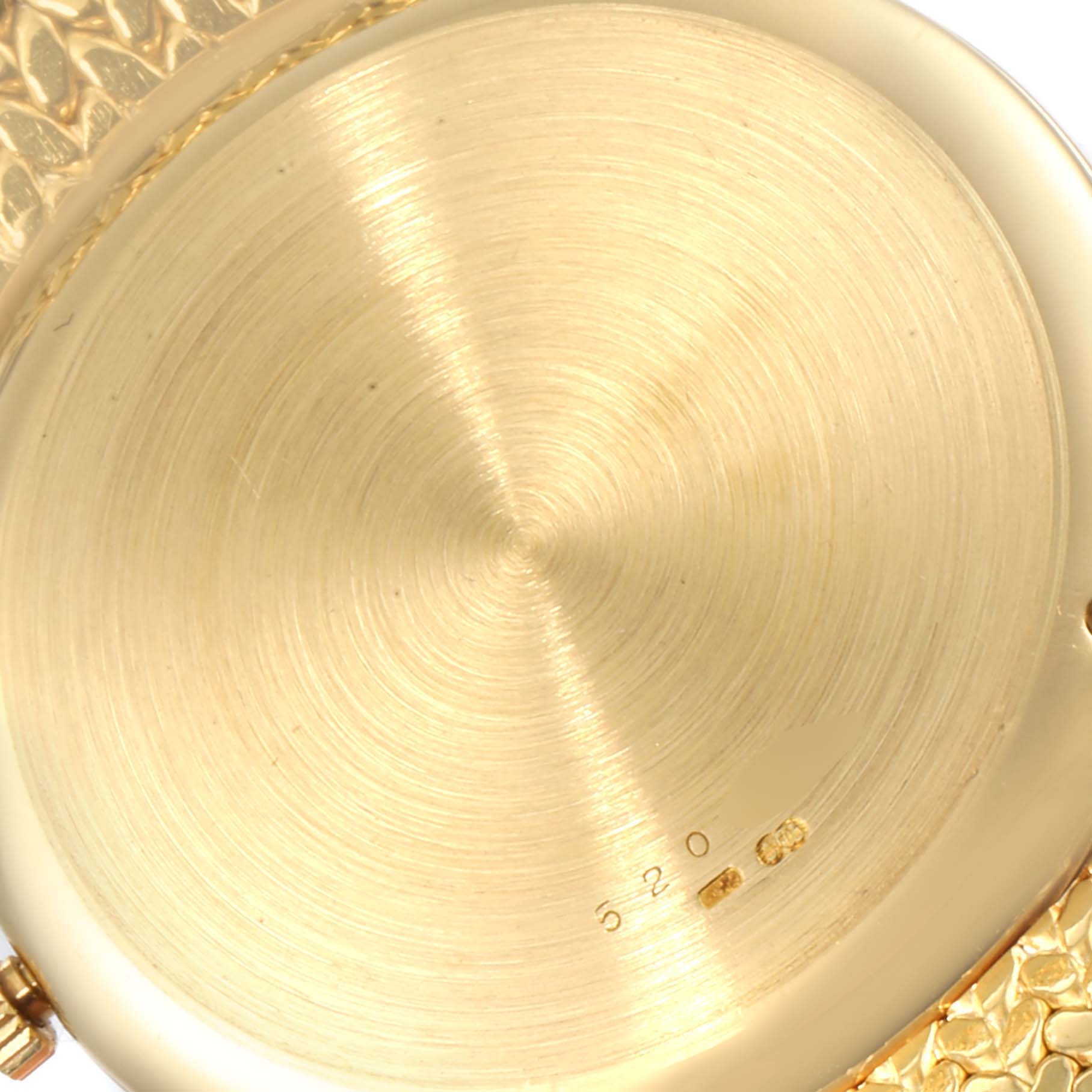 The image shows the back case of a Vacheron Constantin Patrimony 44012 Men's Yellow Gold Champagne Dial 44012 Men's Yellow Gold Champagne Dial watch from a close-up angle.