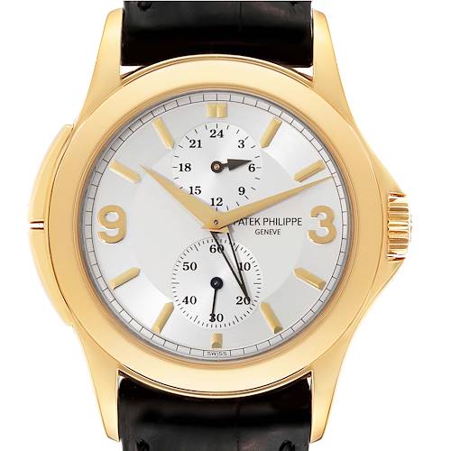 The image shows a frontal view of a Patek Philippe Calatrava 5134J Men's Yellow Gold Silver Dial 5134J Men's Yellow Gold Silver Dial watch, highlighting its face, hands, and black leather strap.