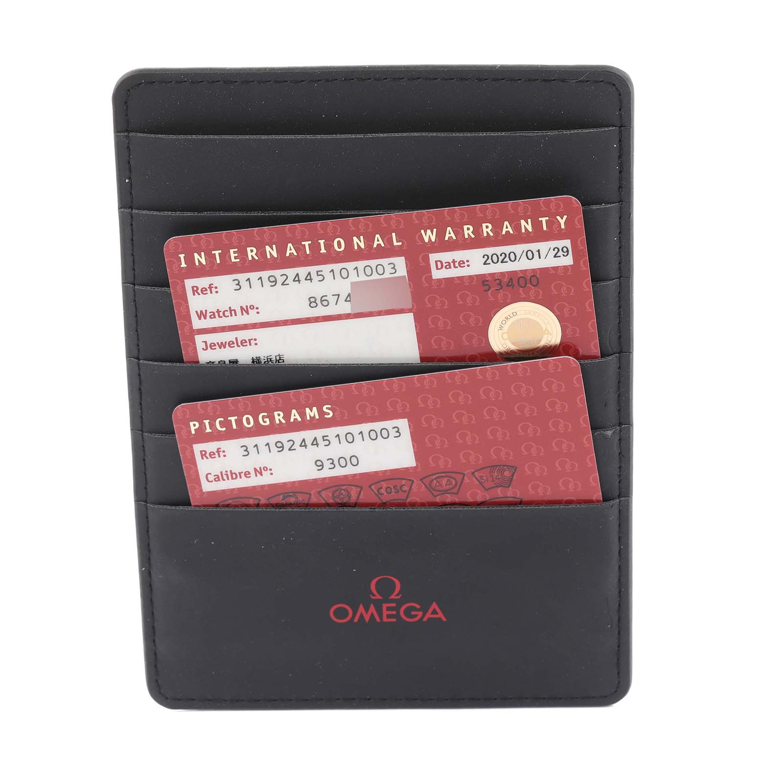 This image shows the international warranty and pictogram cards for an Omega Speedmaster 311.92.44.51.01.003 Men's Ceramic Black Dial 311.92.44.51.01.003 Men's Ceramic Black Dial watch in a cardholder.