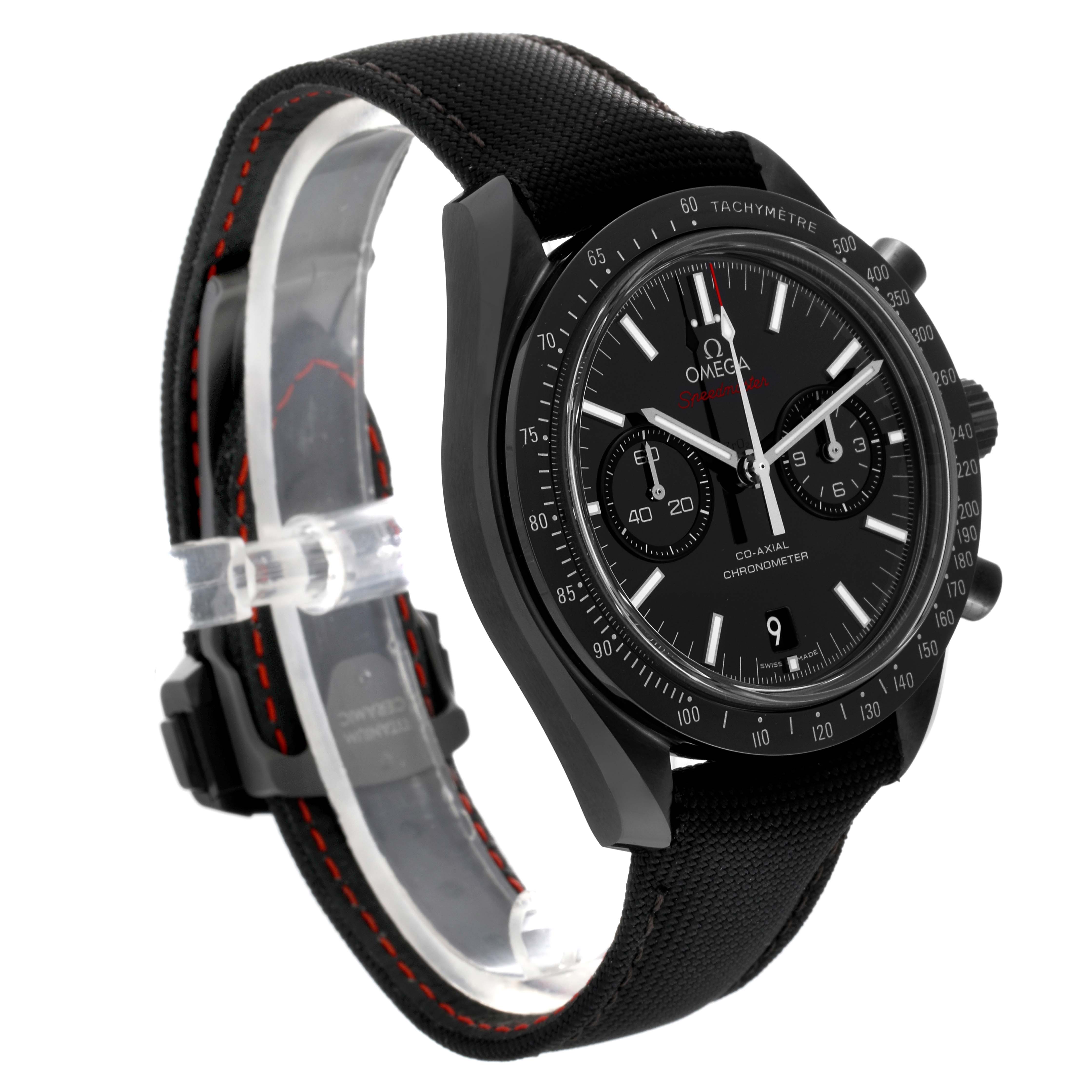 The Omega Speedmaster 311.92.44.51.01.003 Men's Ceramic Black Dial 311.92.44.51.01.003 Men's Ceramic Black Dial watch is shown from a side angle, highlighting the face, bezel, and fabric strap with stitching.