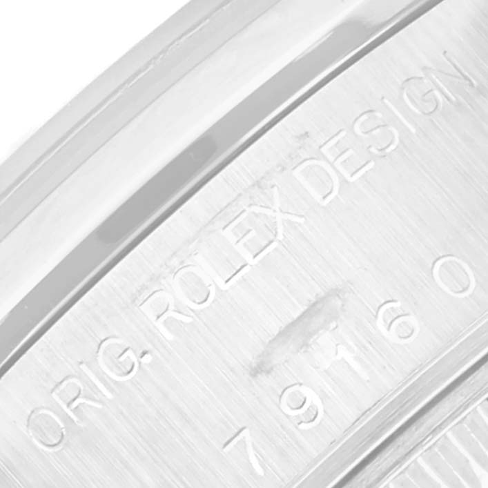 This image shows a close-up of the engraved serial number on the side of a Rolex Date 79160 Women's Stainless Steel White Dial 79160 Women's Stainless Steel White Dial model watch.