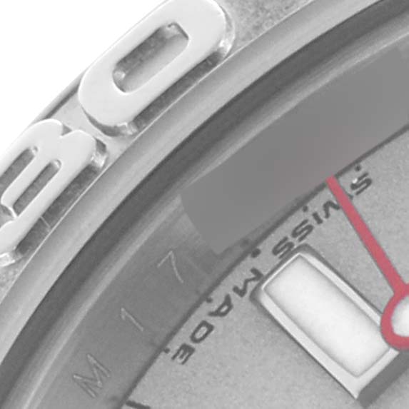 The image shows a close-up of a Rolex Yacht-Master 169622 Women's Stainless Steel Silver Dial 169622 Women's Stainless Steel Silver Dial watch dial, focusing on part of the bezel, indices, and the word "SWISS MADE."