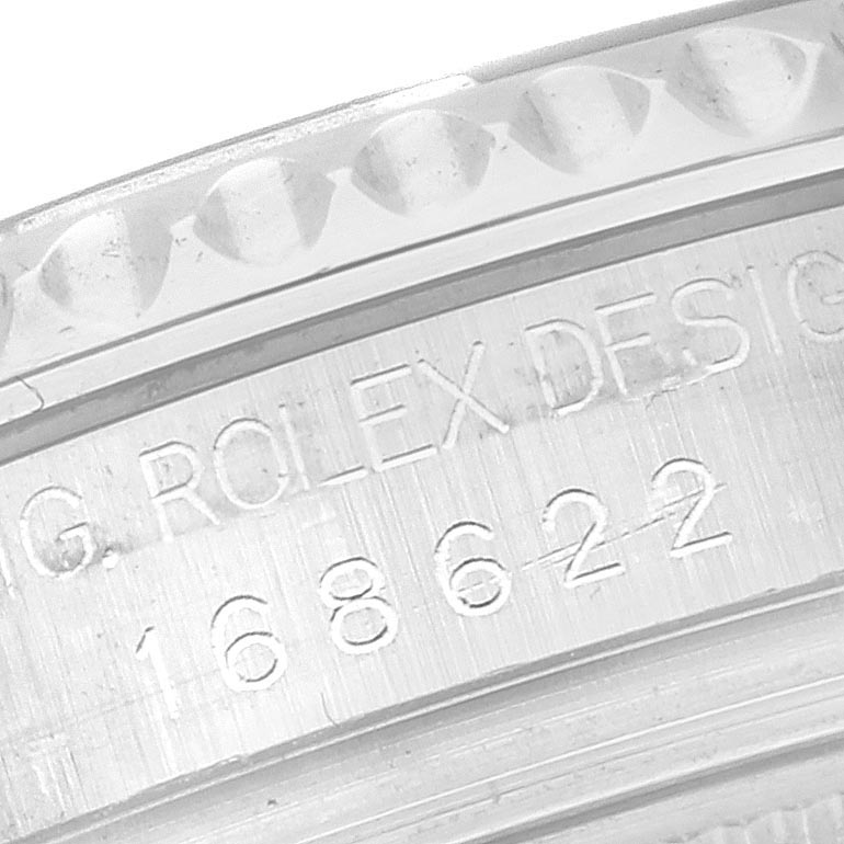 The image shows an angled close-up of the engraved inner bezel of a Rolex Yacht-Master 168622 Men's Stainless Steel Silver Dial 168622 Men's Stainless Steel Silver Dial watch.