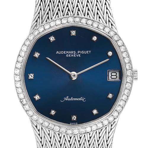 This image shows a frontal view of a Vintage Audemars Piguet watch with a blue dial, diamond indices, date window, and intricate bracelet.