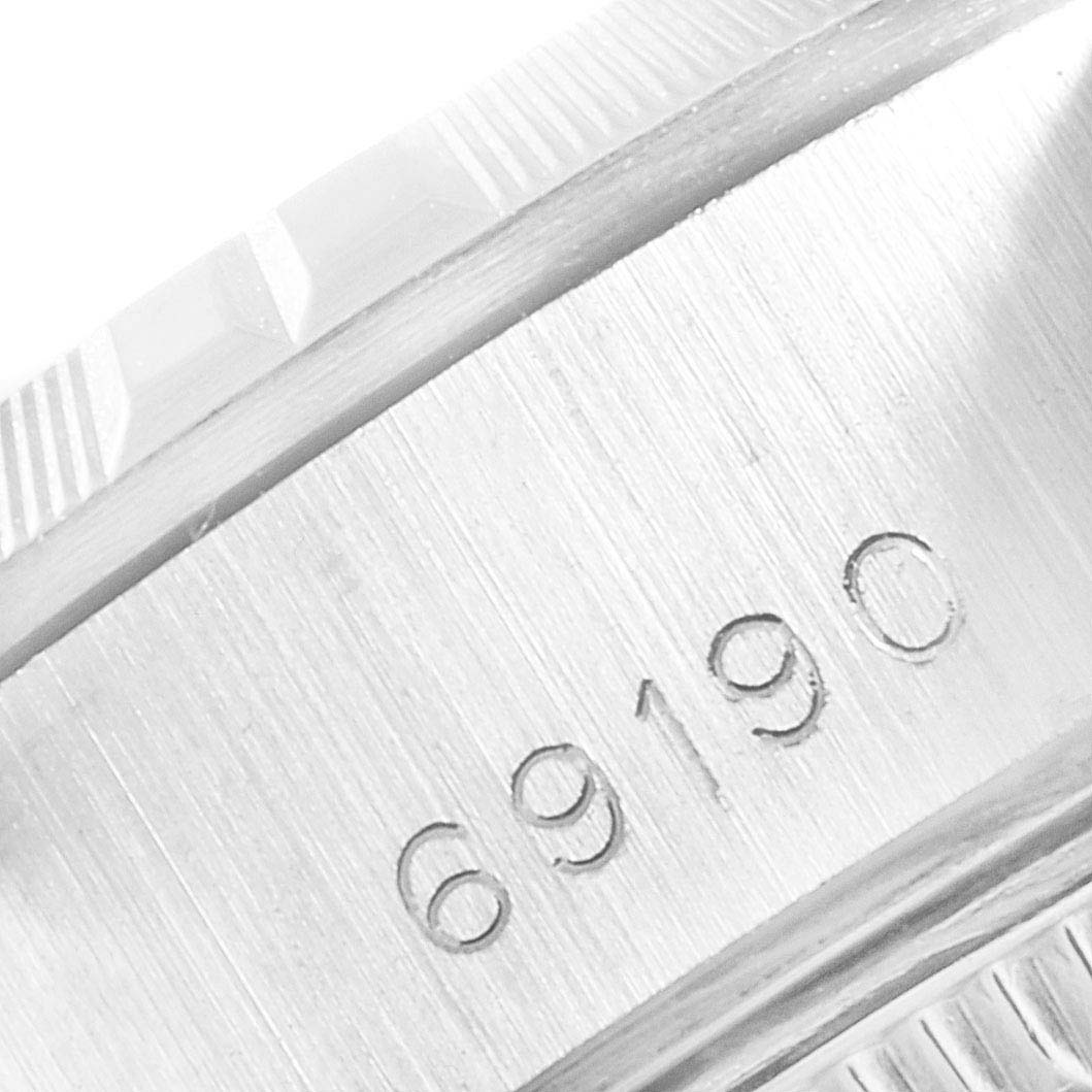 The image shows a close-up of the engraved model number "69190" on the case of a Rolex Date 69190 Women's Stainless Steel White Dial 69190 Women's Stainless Steel White Dial watch.