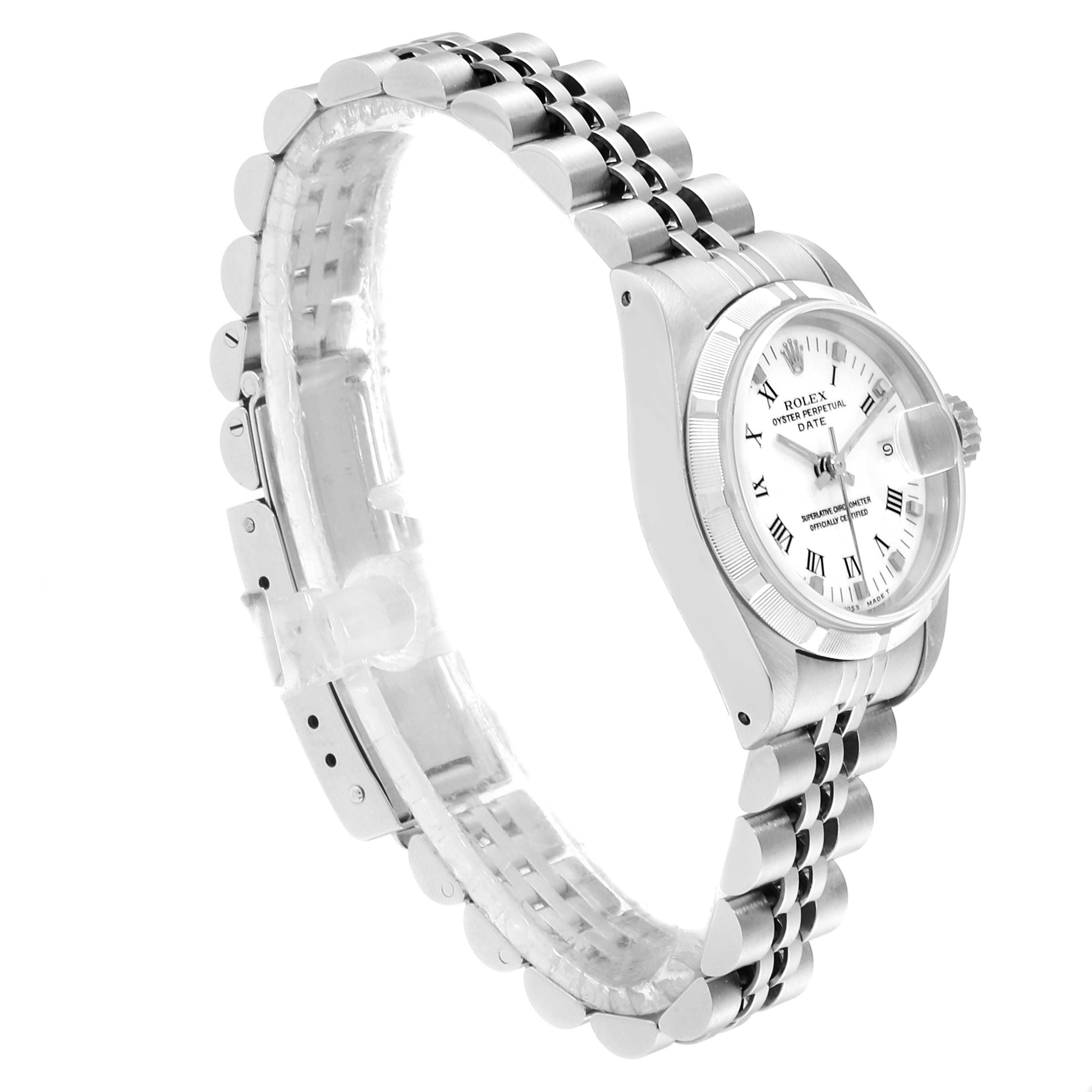 This image shows a side angle of the Rolex Date 69190 Women's Stainless Steel White Dial 69190 Women's Stainless Steel White Dial model, including the face, bezel, crown, and partially visible bracelet.