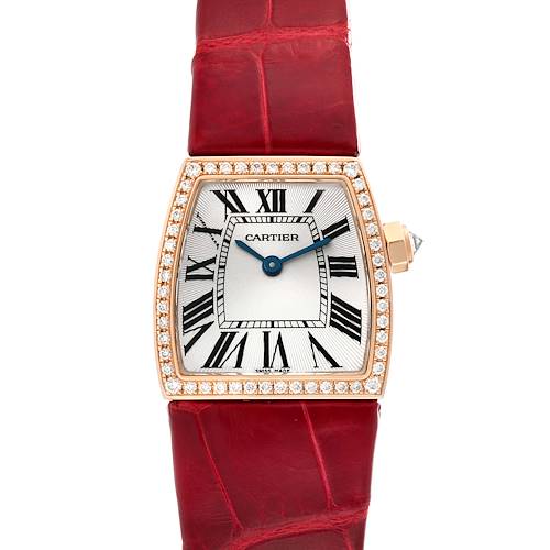 The image shows a La Dona model by Cartier with a red leather strap and a diamond-studded bezel viewed from the front.