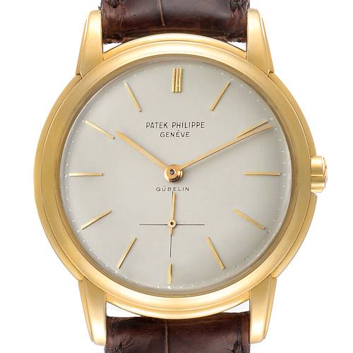 This is a front view of a Patek Philippe Calatrava 2551J Men's Yellow Gold Silver Dial 2551J Men's Yellow Gold Silver Dial watch, showing the dial, hands, case, and part of the strap.