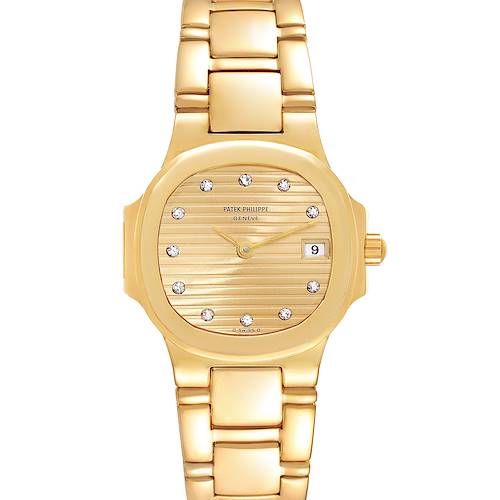 The image shows a frontal view of a Patek Philippe Nautilus 4700/51 Women's Yellow Gold Champagne Dial 4700/51 Women's Yellow Gold Champagne Dial watch, highlighting its gold case, diamond hour markers, and date display.