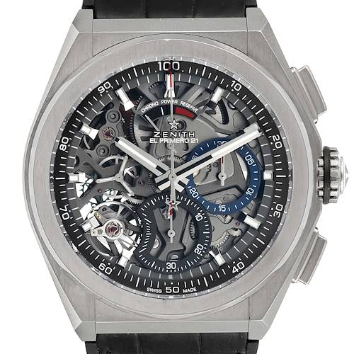 The image shows a front view of a Zenith Defy 95.9000.9004/78.M9000 Men's Titanium Grey Dial 95.9000.9004/78.M9000 Men's Titanium Grey Dial El Primero 21 watch, highlighting its intricate dial and mechanical components.
