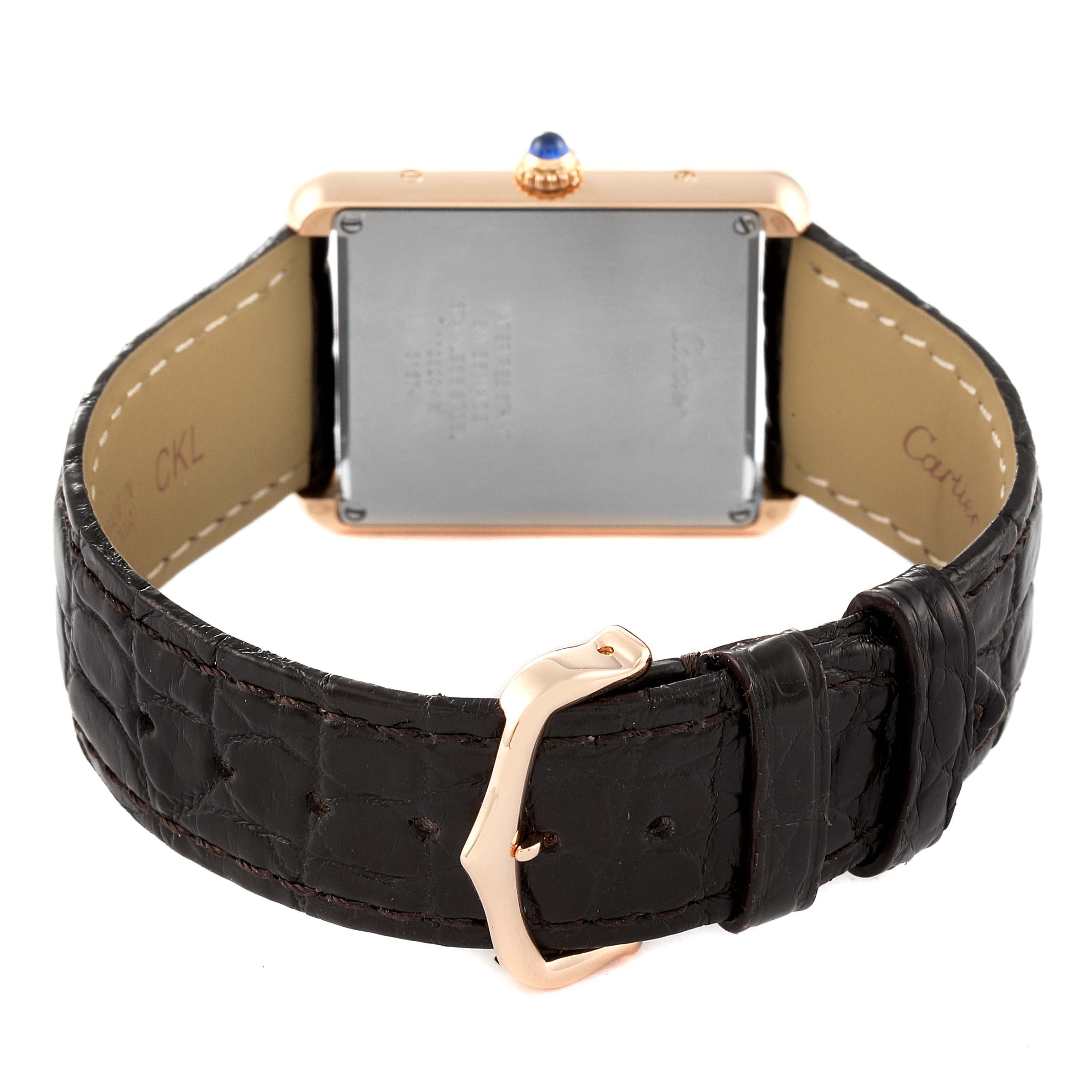 The image shows the back view of a Cartier Tank Solo W5200025 Men's Rose Gold Silver Dial W5200025 Men's Rose Gold Silver Dial watch, highlighting its buckle, strap, and case back.