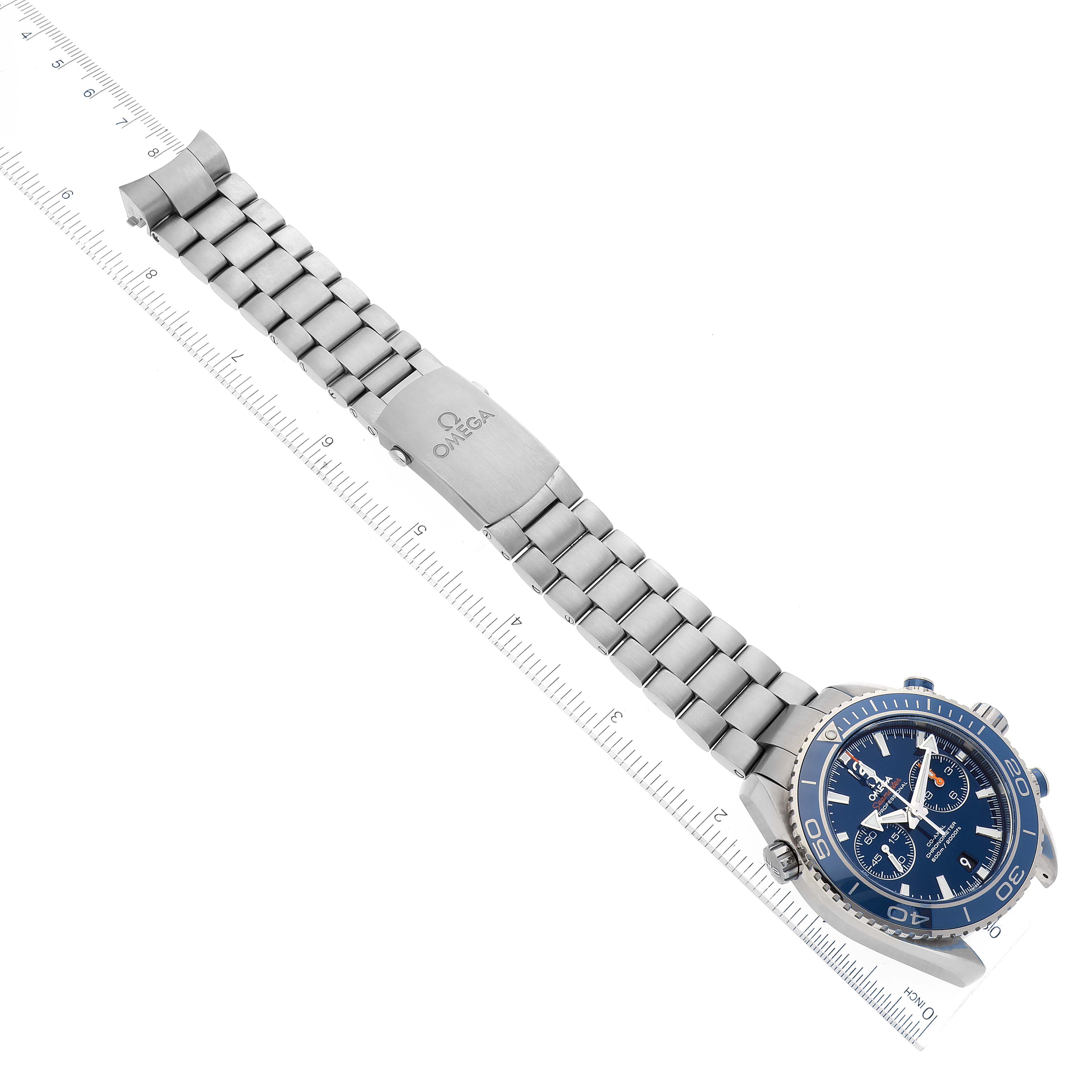 The image shows the Omega Planet Ocean 232.90.46.51.03.001 Men's Titanium Blue Dial 232.90.46.51.03.001 Men's Titanium Blue Dial watch laid flat, showcasing its stainless steel bracelet, clasp, and blue dial from a top-down angle.