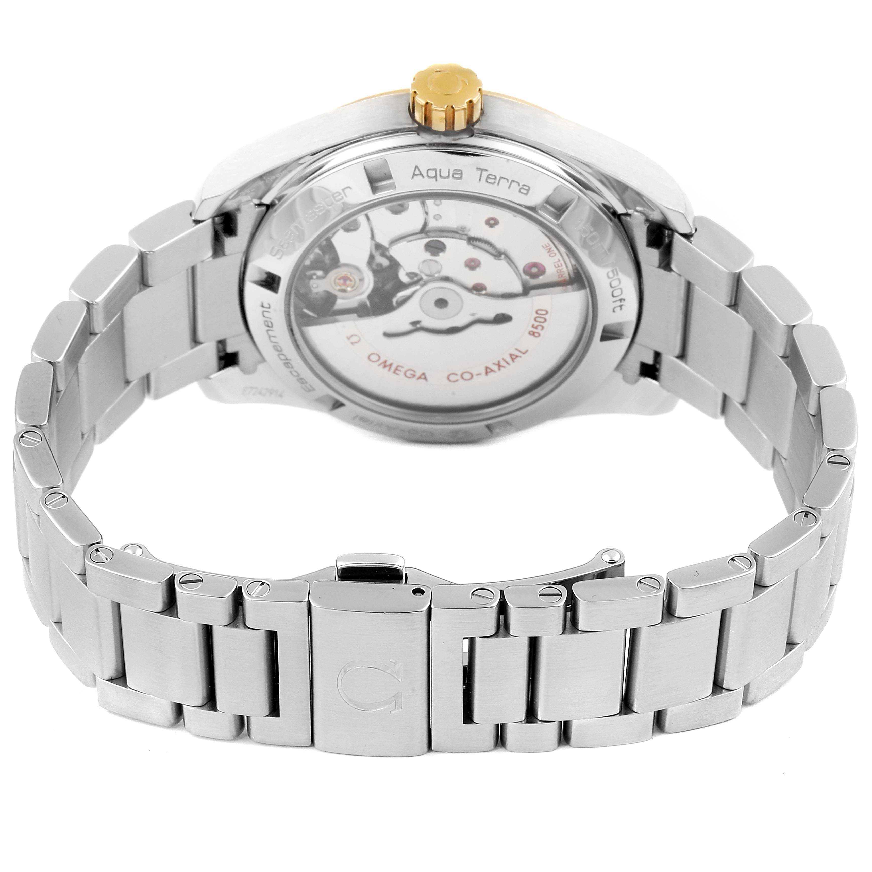 The image shows the back view of the Omega Aqua Terra 231.20.39.21.06.004 Men's Steel and Gold (two tone) Grey Dial 231.20.39.21.06.004 Men's Steel and Gold (two tone) Grey Dial watch, highlighting the clasp, bracelet, and visible movement mechanism.