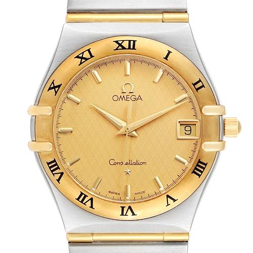 The image shows a frontal view of an Omega Constellation 1212.10.00 Men's Steel and Gold (two tone) Champagne Dial 1212.10.00 Men's Steel and Gold (two tone) Champagne Dial watch, highlighting its gold dial, Roman numeral bezel, and date window.