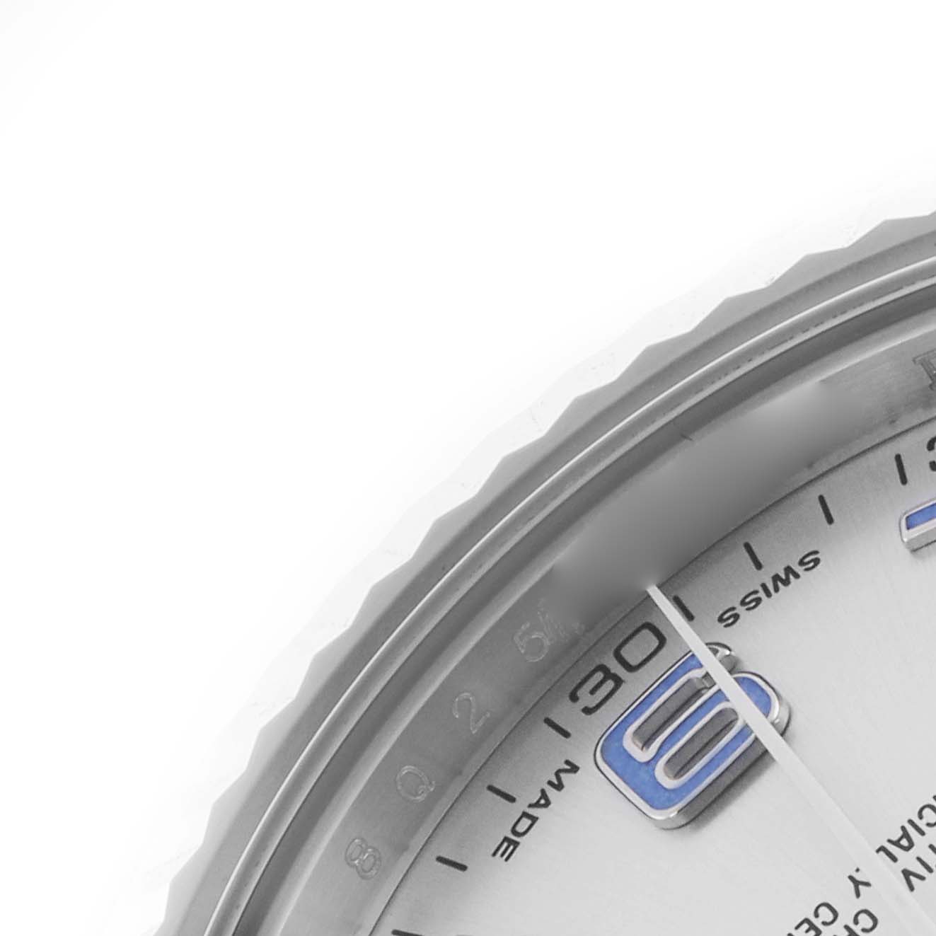 The image shows a close-up of the Rolex Datejust 41 116334 Men's Stainless Steel Silver Dial 116334 Men's Stainless Steel Silver Dial's dial, focusing on the 9 o'clock marker and edge of the bezel.