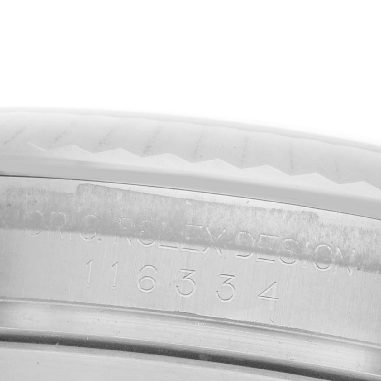The image shows an engraved side view of the Rolex Datejust 41 116334 Men's Stainless Steel Silver Dial 116334 Men's Stainless Steel Silver Dial, focusing on the case's model number details.