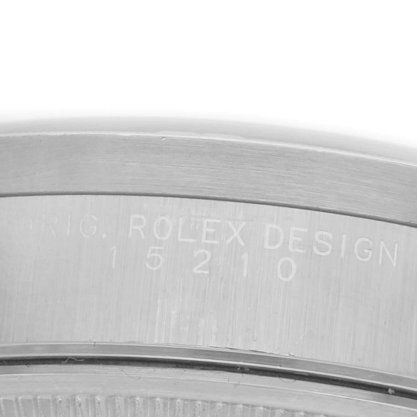 The image shows a close-up of the side of a Rolex Date 15210 Men's Stainless Steel Blue Dial 15210 Men's Stainless Steel Blue Dial model watch, highlighting the engraved model number.