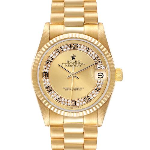 The Rolex Mid-Size watch is shown from a top-down angle, highlighting the gold bracelet, diamond-set bezel, dial, and date window.