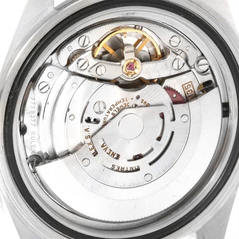 This image shows a close-up view of the movement and internal mechanisms of a Rolex Submariner 16610 Men's Stainless Steel Black Dial 16610 Men's Stainless Steel Black Dial watch.