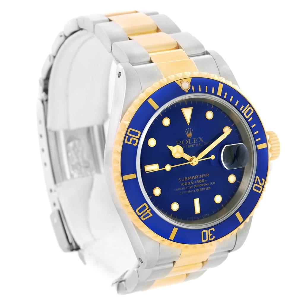 The Rolex Submariner 16613 Men's Steel and Gold (two tone) Blue Dial 16613 Men's Steel and Gold (two tone) Blue Dial watch is shown at an angle displaying the face, bezel, and part of its two-tone bracelet.