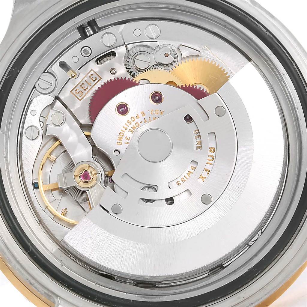 This image shows the internal movement mechanism of a Rolex Submariner 16613 Men's Steel and Gold (two tone) Blue Dial 16613 Men's Steel and Gold (two tone) Blue Dial watch from a back angle.