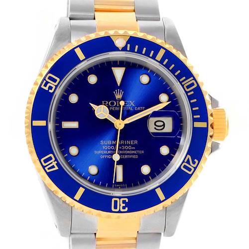 The image shows a front view of the Rolex Submariner 16613 Men's Steel and Gold (two tone) Blue Dial 16613 Men's Steel and Gold (two tone) Blue Dial watch, highlighting its blue dial, date display, and two-tone bracelet.