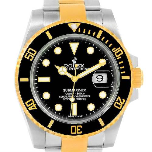 The image shows a front view of a Rolex Submariner 116613 Men's Steel and Gold (two tone) Black Dial 116613 Men's Steel and Gold (two tone) Black Dial watch, highlighting the face, bezel, and part of the bezel, along with the crown.