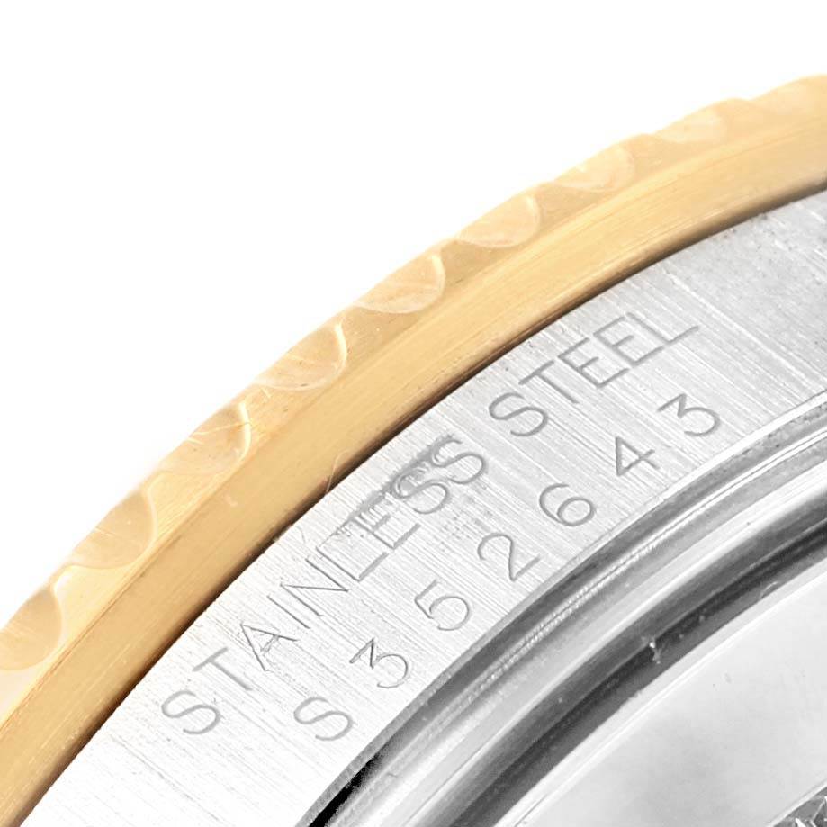 The image shows a close-up of the stainless steel case and gold bezel edge of a Rolex Submariner 16613 Men's Steel and Gold (two tone) Champagne Dial 16613 Men's Steel and Gold (two tone) Champagne Dial watch.