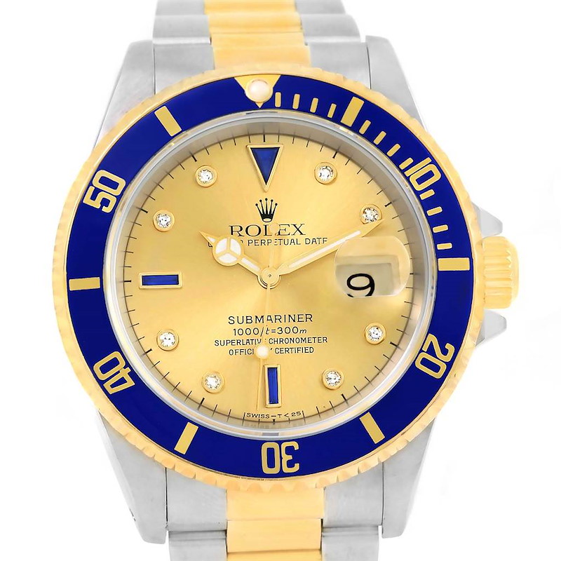 The image shows a front view of a Rolex Submariner 16613 Men's Steel and Gold (two tone) Champagne Dial 16613 Men's Steel and Gold (two tone) Champagne Dial watch with a gold dial, blue bezel, and two-tone gold and silver bracelet.
