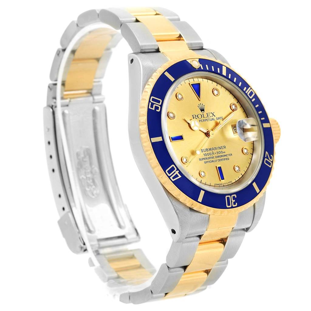 This image shows a side angle of a Rolex Submariner 16613 Men's Steel and Gold (two tone) Champagne Dial 16613 Men's Steel and Gold (two tone) Champagne Dial watch, highlighting the gold and blue bezel, dial, and metallic strap.