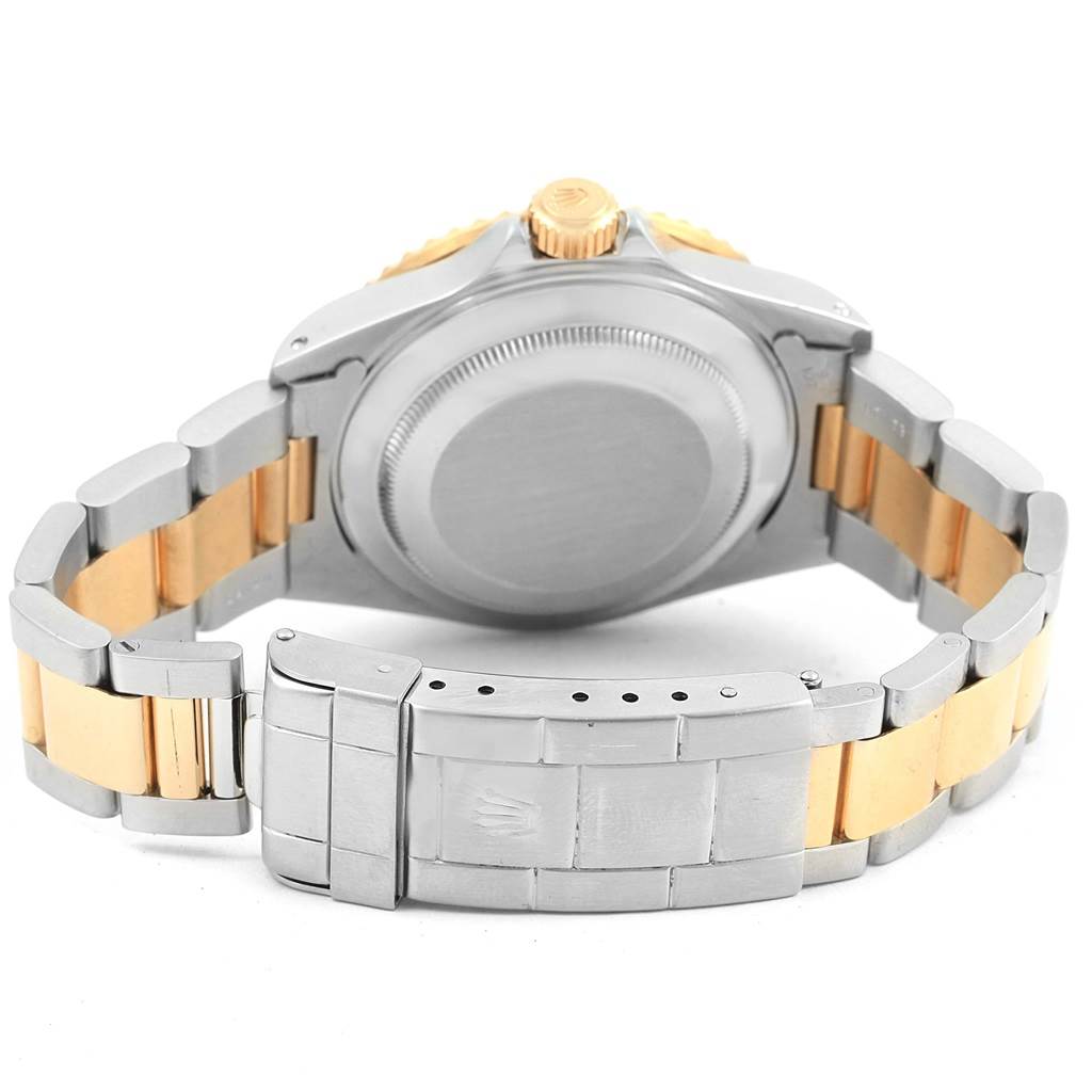 This image shows the back of the case and bracelet of a Rolex Submariner 16613 Men's Steel and Gold (two tone) Champagne Dial 16613 Men's Steel and Gold (two tone) Champagne Dial watch.