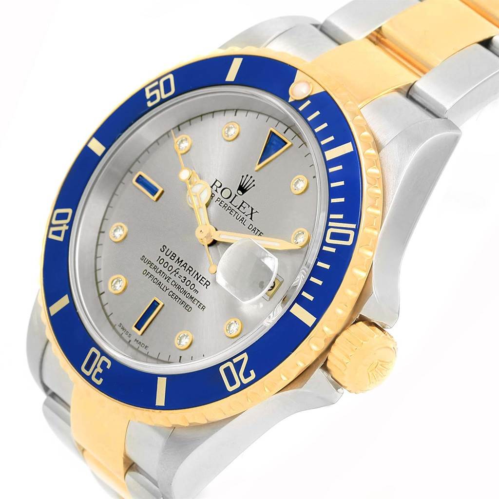 The image shows a close-up angle of the Rolex Submariner 16613 Men's Steel and Gold (two tone) Grey Dial 16613 Men's Steel and Gold (two tone) Grey Dial watch, focusing on the bezel, dial, and part of the bracelet.