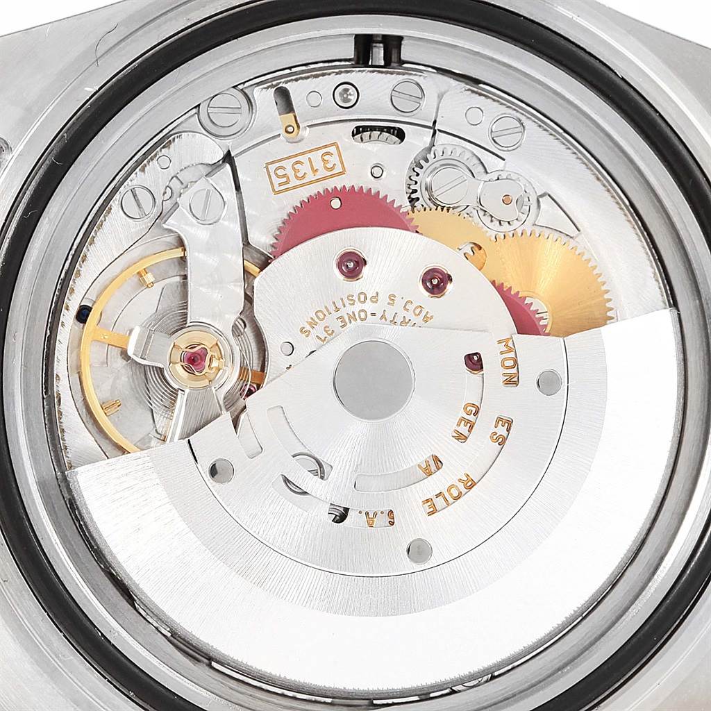 This image shows a close-up of the inner mechanical workings of a Rolex Submariner 16613 Men's Steel and Gold (two tone) Grey Dial 16613 Men's Steel and Gold (two tone) Grey Dial watch, focusing on its movement components.