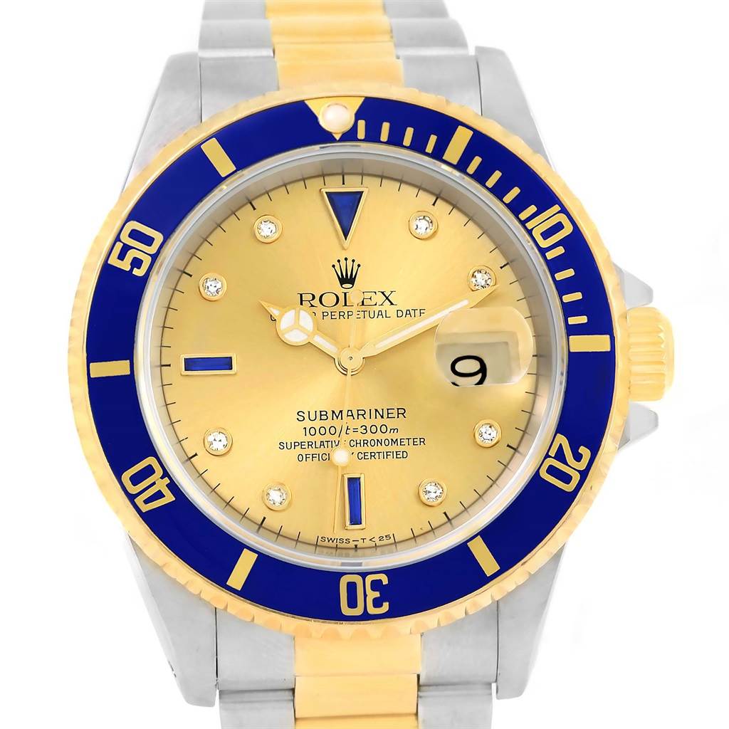 The Rolex Submariner 16613 Men's Steel and Gold (two tone) Champagne Dial 16613 Men's Steel and Gold (two tone) Champagne Dial watch is shown from a top-down angle, displaying its dial, bezel, and part of the bracelet.