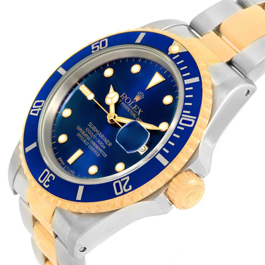 The image shows a close-up angled view of the Rolex Submariner 16613 Men's Steel and Gold (two tone) Blue Dial 16613 Men's Steel and Gold (two tone) Blue Dial watch face, bezel, crown, and part of the bracelet.