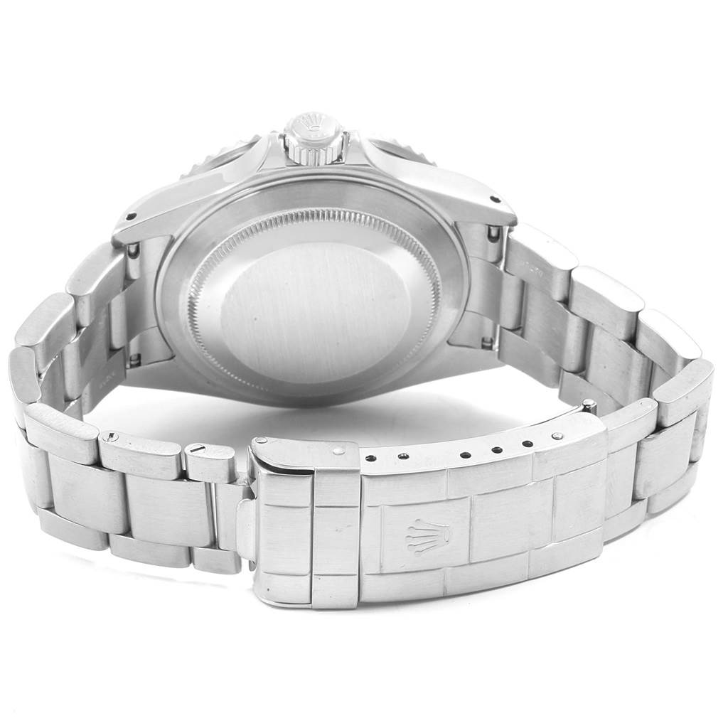 This image shows the back view of a Rolex Submariner 16610 Men's Stainless Steel Black Dial 16610 Men's Stainless Steel Black Dial watch, highlighting the case back and part of the bracelet with the clasp.