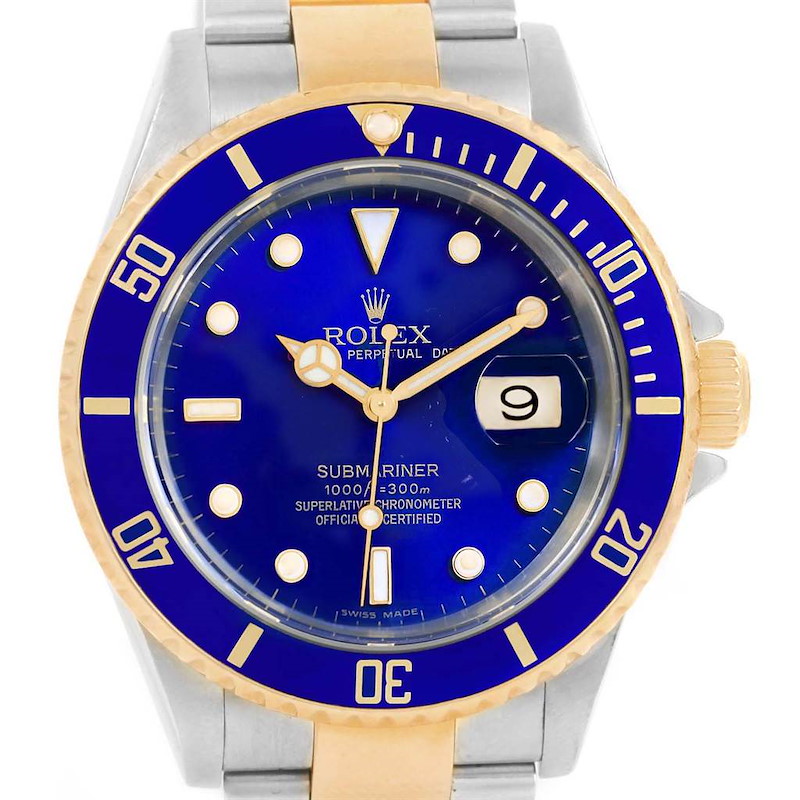 The image shows a front view of a Rolex Submariner 16613 Men's Steel and Gold (two tone) Blue Dial 16613 Men's Steel and Gold (two tone) Blue Dial watch, highlighting its blue dial, bezel, and two-tone bracelet.