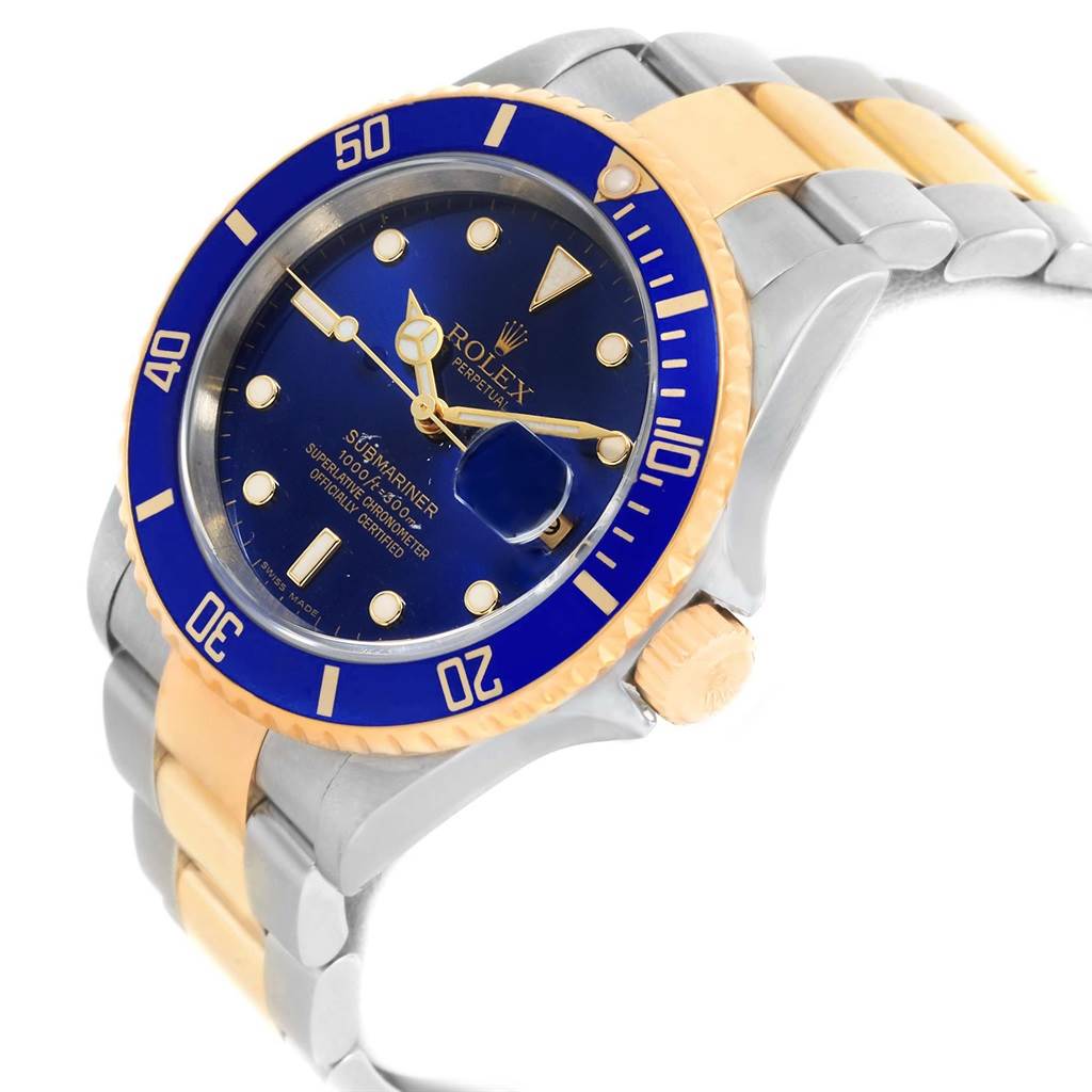The image shows a three-quarter angle view of a Rolex Submariner 16613 Men's Steel and Gold (two tone) Blue Dial 16613 Men's Steel and Gold (two tone) Blue Dial watch, highlighting the bezel, dial, and bracelet.