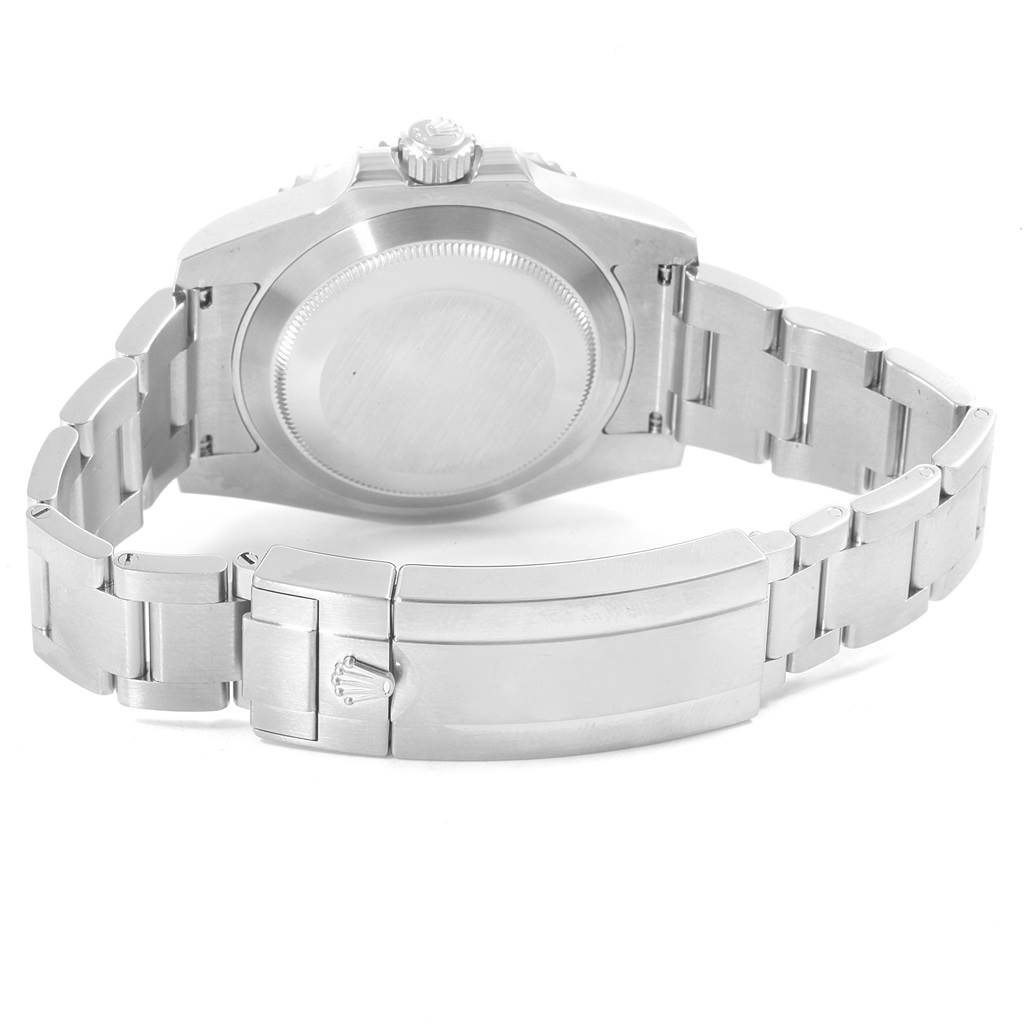 The image shows the back side of a Rolex Submariner 114060 Men's Stainless Steel Black Dial 114060 Men's Stainless Steel Black Dial watch focusing on the case back and bracelet with the clasp.