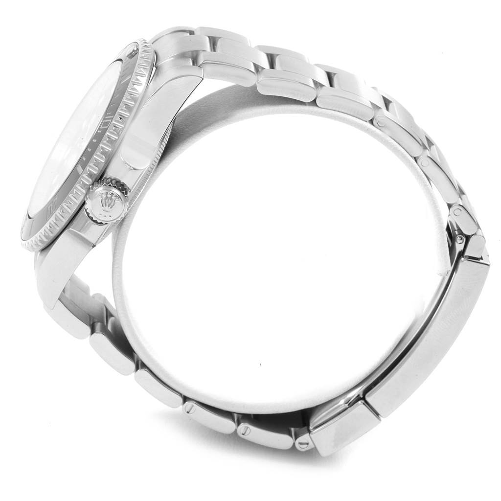 The image shows a side view of a Rolex Submariner 114060 Men's Stainless Steel Black Dial 114060 Men's Stainless Steel Black Dial watch, highlighting its crown, bezel, case, and part of the bracelet.