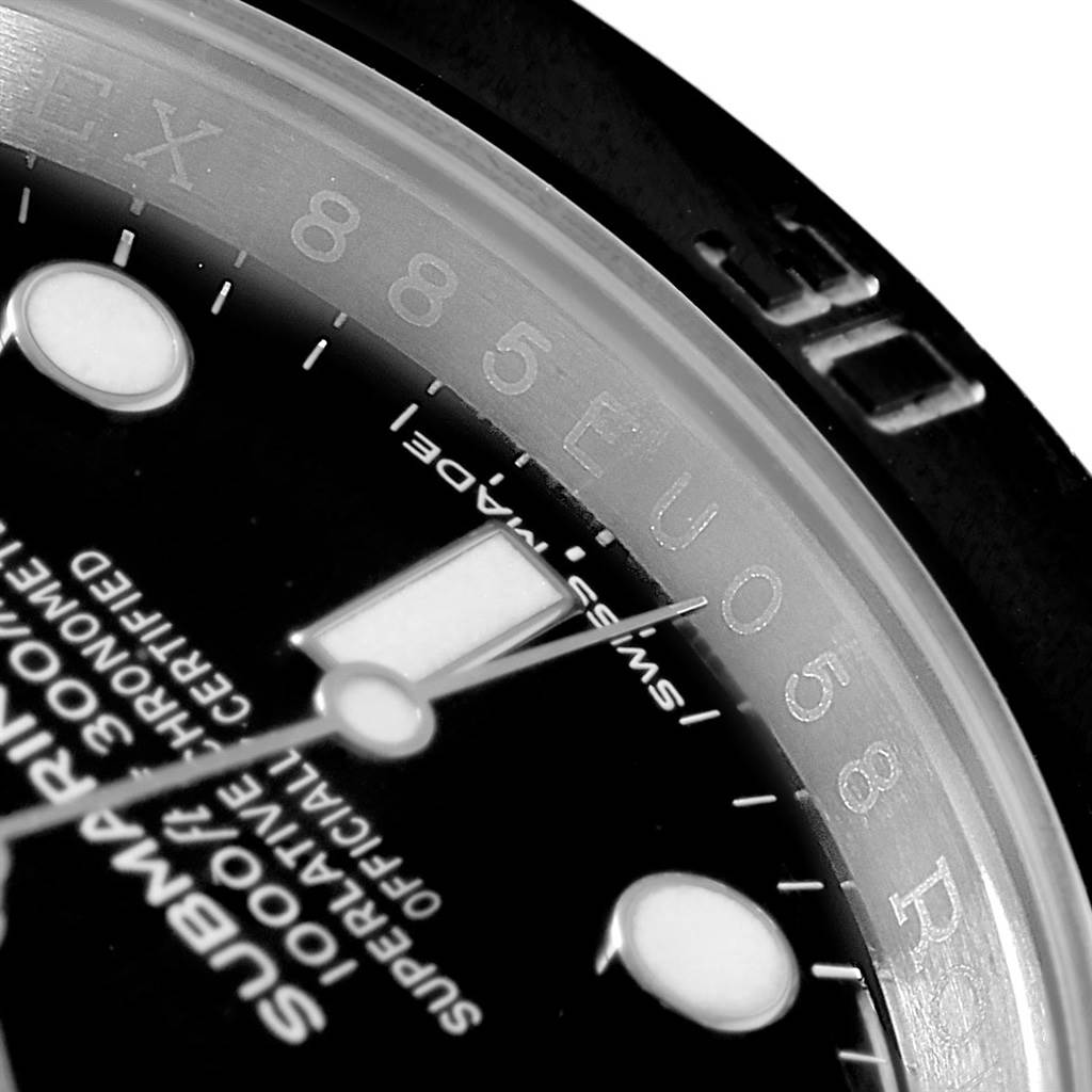 This close-up angle shows the dial, hour markers, and part of the bezel of the Rolex Submariner 114060 Men's Stainless Steel Black Dial 114060 Men's Stainless Steel Black Dial watch.