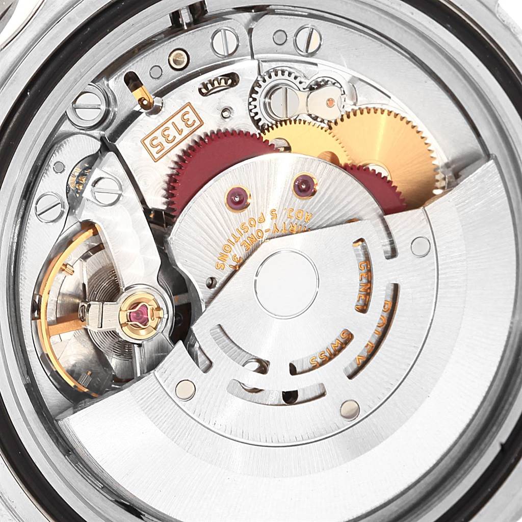 This image shows a close-up view of the intricate movement mechanism inside a Rolex Submariner 16610 Men's Stainless Steel Black Dial 16610 Men's Stainless Steel Black Dial watch.