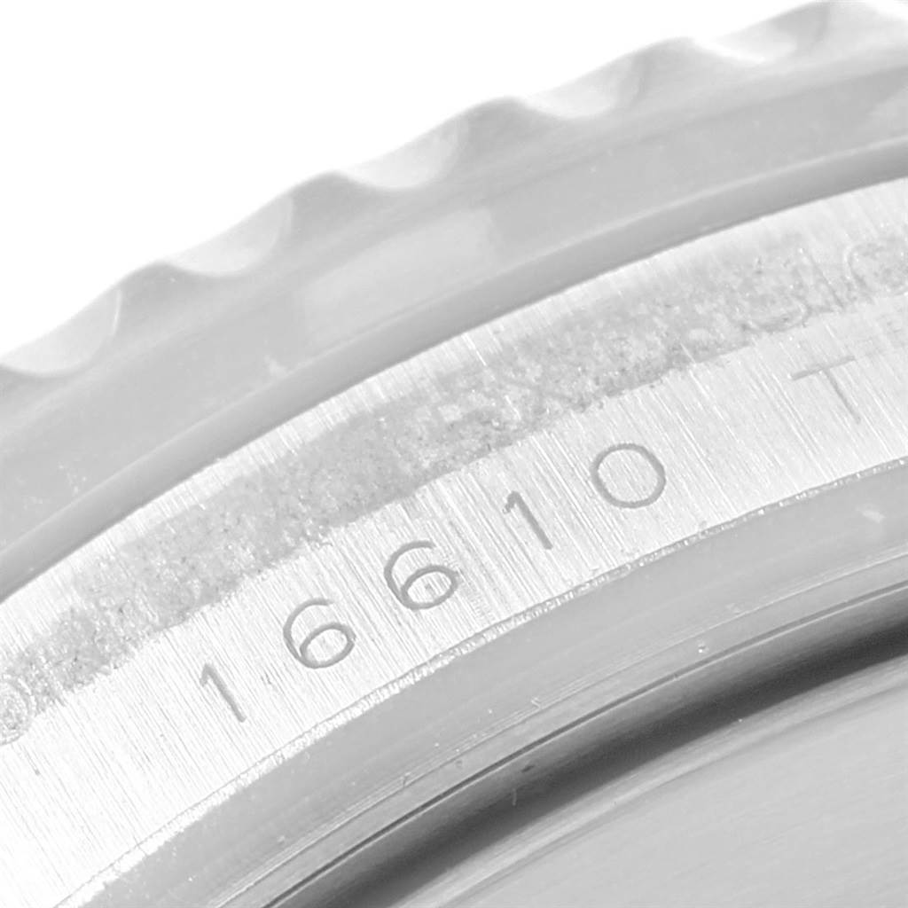 The image shows a close-up of the bezel and case of the Rolex Submariner 16610LV Men's Stainless Steel Black Dial 16610LV Men's Stainless Steel Black Dial, focusing on the model number engraving.