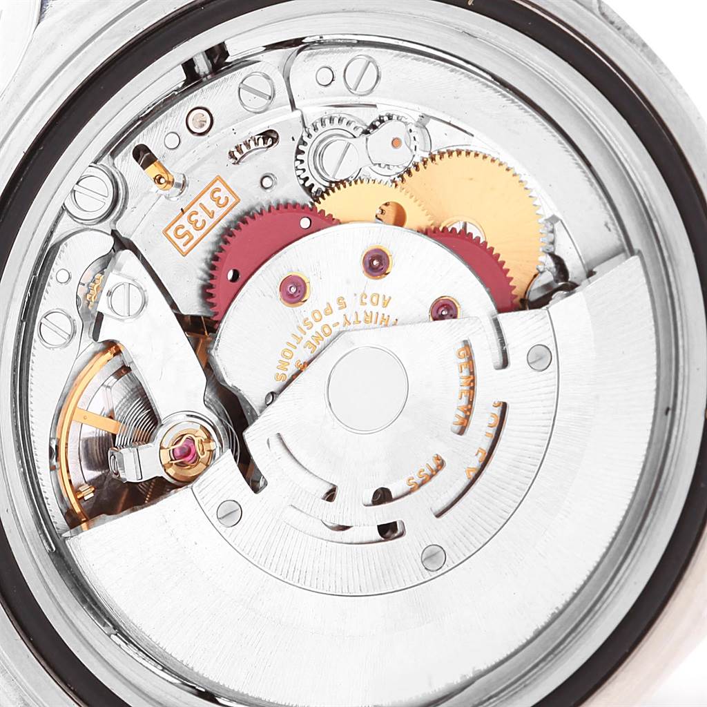 This image shows a close-up of the movement mechanism of a Rolex Submariner 16610LV Men's Stainless Steel Black Dial 16610LV Men's Stainless Steel Black Dial watch.