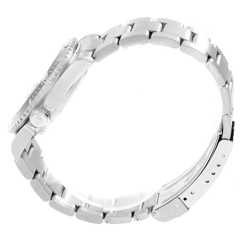 The image shows a side profile view of the Rolex Submariner 16610 Men's Stainless Steel Black Dial 16610 Men's Stainless Steel Black Dial watch, highlighting its case, crown, and metal bracelet with clasp.