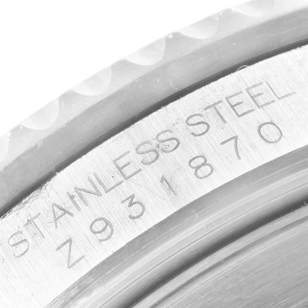 This image shows a close-up of the case side engravings on a Rolex Submariner 16610 Men's Stainless Steel Black Dial 16610 Men's Stainless Steel Black Dial watch, highlighting the stainless steel material and serial number.