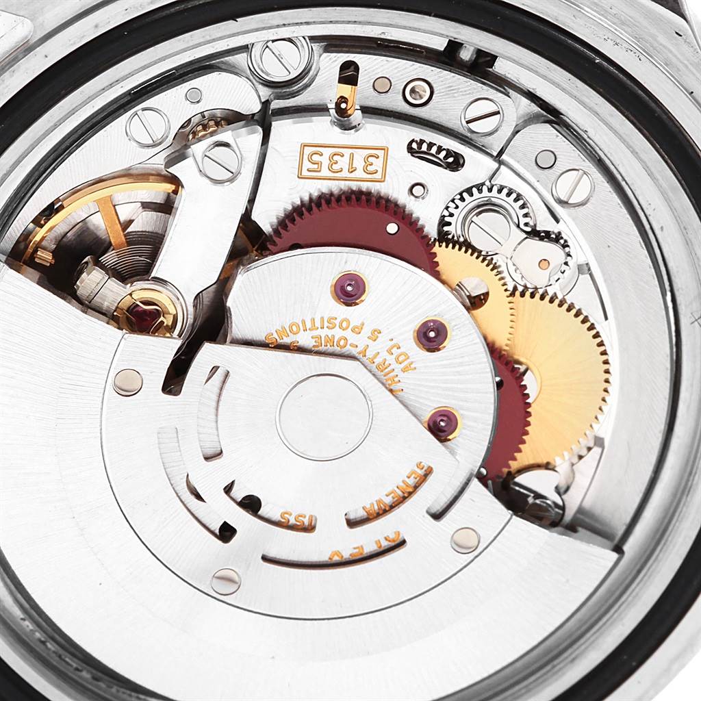 This image shows the internal movement mechanism of a Rolex Submariner 16610 Men's Stainless Steel Black Dial 16610 Men's Stainless Steel Black Dial watch, highlighting its gears and components.