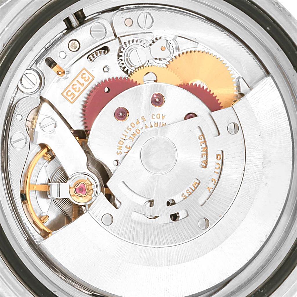 This image shows the internal mechanism and movement of a Rolex Submariner 16610LV Men's Stainless Steel Black Dial 16610LV Men's Stainless Steel Black Dial watch, viewed from the back.