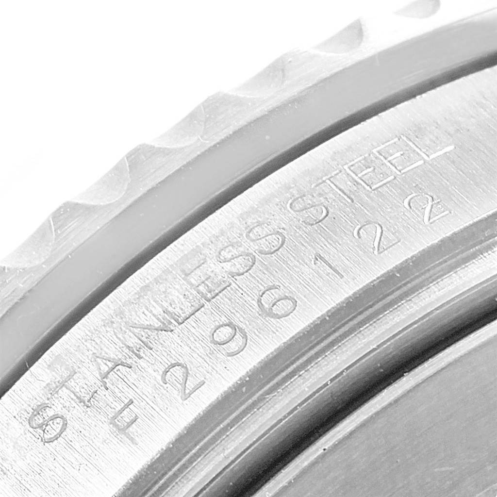 The image shows a close-up of the side bezel and serial number engraving on a stainless steel Rolex Submariner 16610LV Men's Stainless Steel Black Dial 16610LV Men's Stainless Steel Black Dial watch.