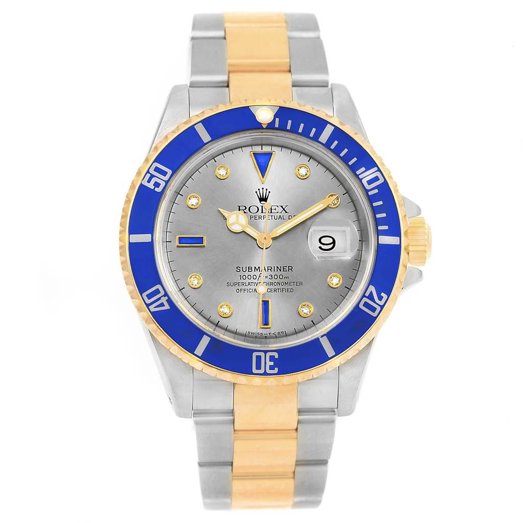 This Rolex Submariner 16613 Men's Steel and Gold (two tone) Grey Dial 16613 Men's Steel and Gold (two tone) Grey Dial watch is shown from a front angle, highlighting its blue bezel, gray dial, and two-tone bracelet.